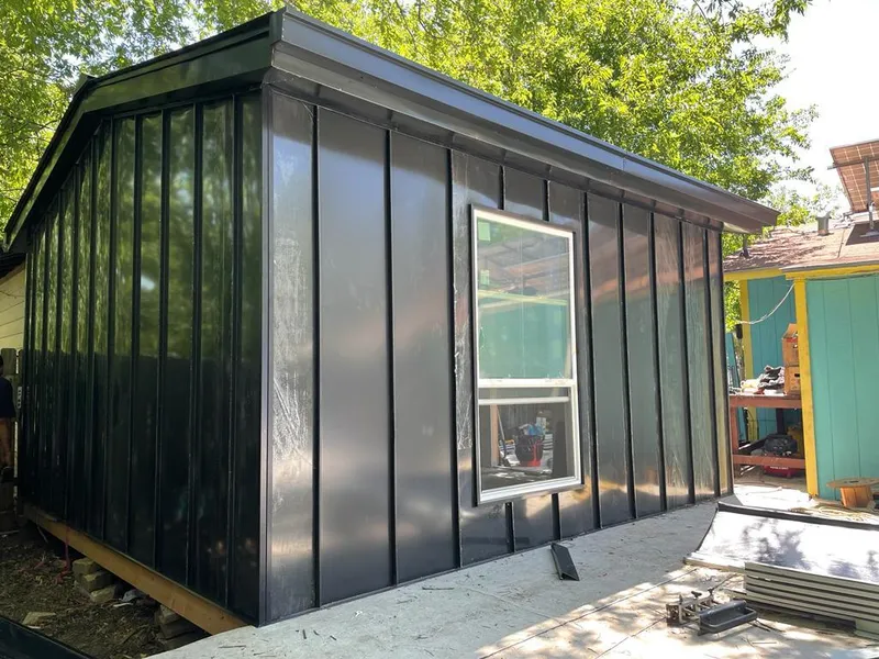 Black standing seam metal wall panels for Metal Roof Installation in Sand Lake